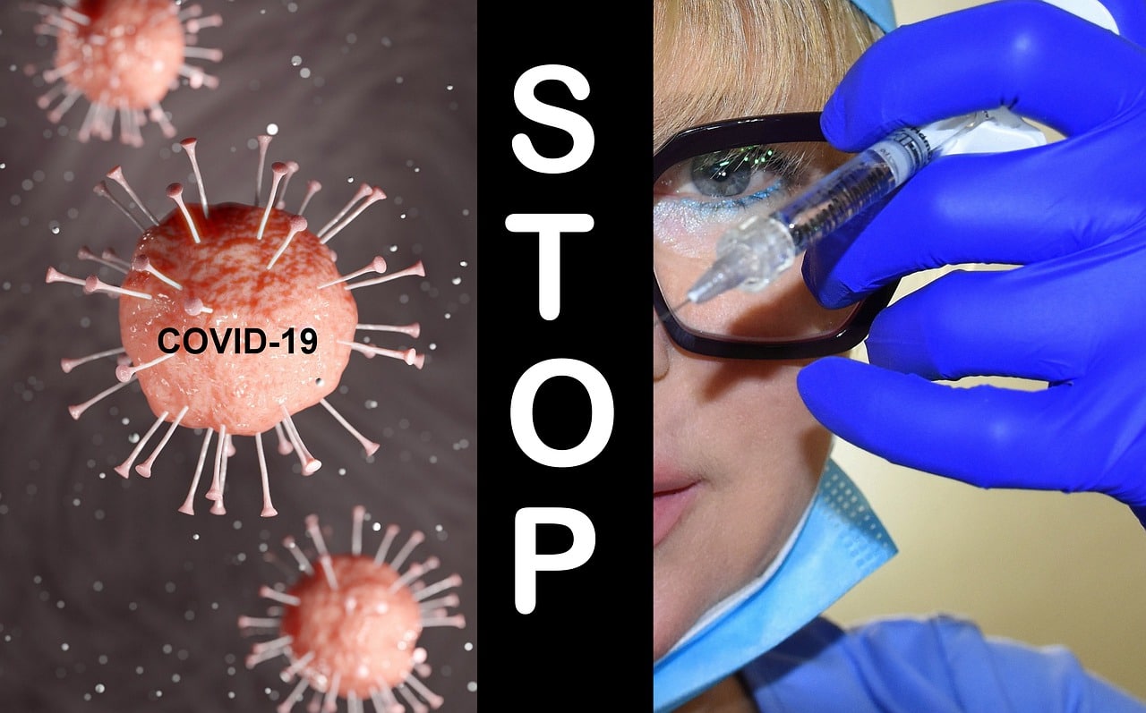 covid a sinistra e ricercatrice con vaccino a destra, al centro "stop"